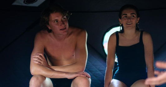 A group of friends sit in a portable sauna during the winter months for health benefits